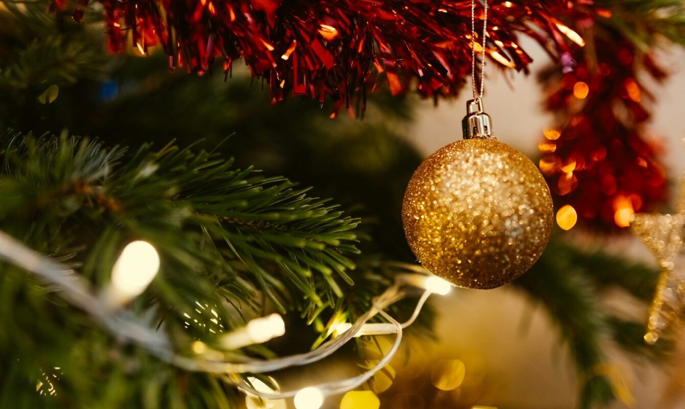 closeup photo of gold glittered Christmas bauble