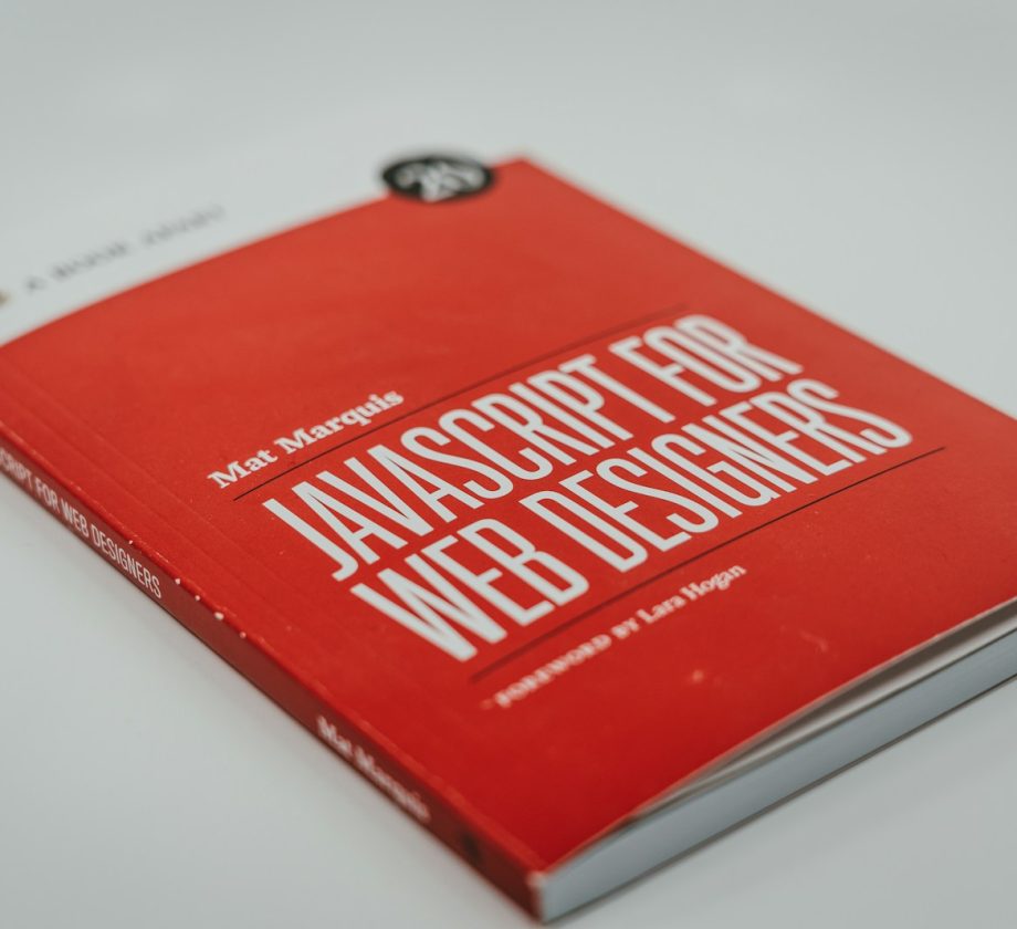 a red book sitting on top of a white table